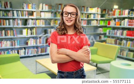 smiling student girl in glasses at library smiling student girl in glasses at library 55577111
