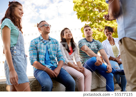 happy international friends talking in city happy international friends talking in city 55577135