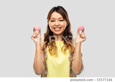happy asian woman with macarons happy asian woman with macarons 55577188