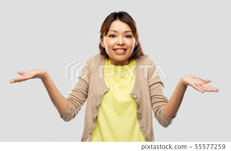 clueless asian woman shrugging 55577259