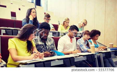 group of students with smartphone at lecture 55577706