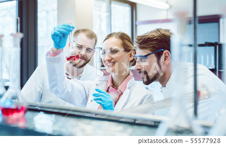 Scientific Chemists synthesizing a new compound 55577928