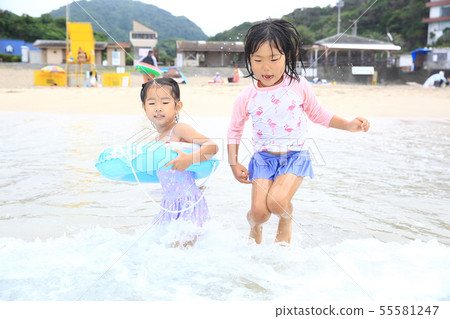 Girl bathing in the sea 55581247
