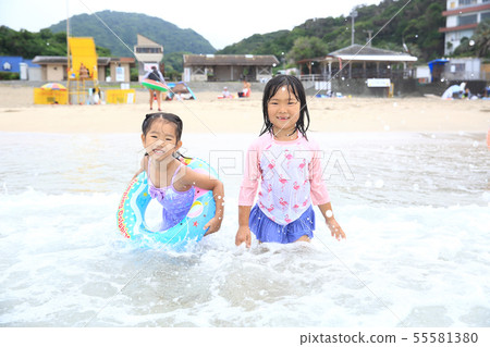 Girl bathing in the sea 55581380