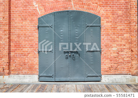 Texture of brick wall with door for background Texture of brick wall with door for background 55581471