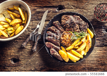 Grilled beef Rib Eye steak with garlic american Grilled beef Rib Eye steak with garlic american 55581666