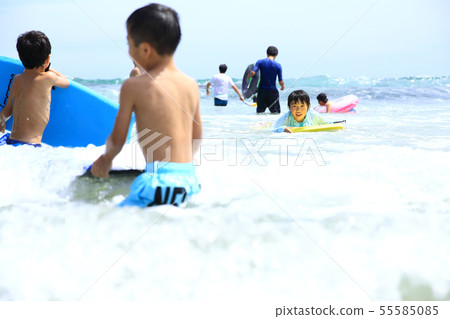 Boys playing on the beach 55585085