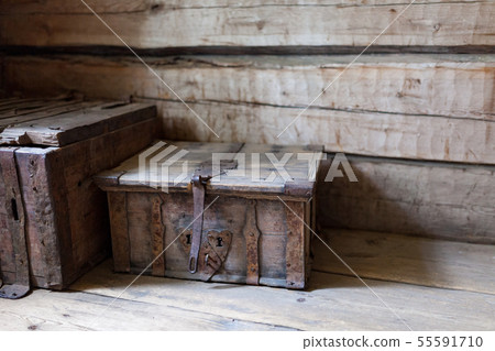 Old wooden chest on floor 55591710