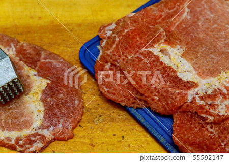 Meat slices with meat hammer Meat slices with meat hammer 55592147
