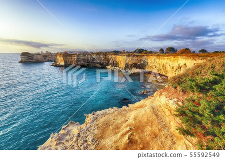 Picturesque seascape with cliffs rocky arch and Picturesque seascape with cliffs rocky arch and 55592549