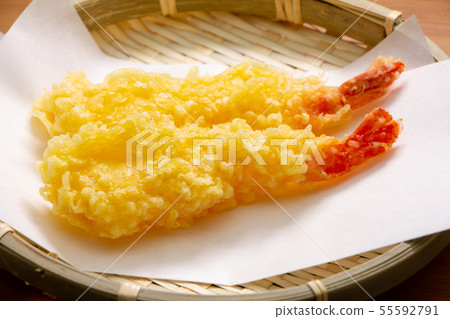 Two shrimp tempura. (Fried straight and served on a tempura laid paper.) 55592791