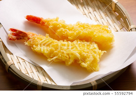 Two shrimp tempura. (Fried straight and served on a tempura laid paper.) 55592794
