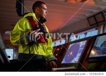 Navigator. pilot, captain as part of ship crew Navigator. pilot, captain as part of ship crew 55592854