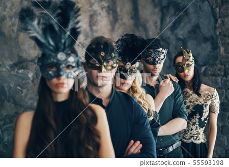 Group of people in masquerade carnival mask posing in studio Group of people in masquerade carnival mask posing in studio 55593198