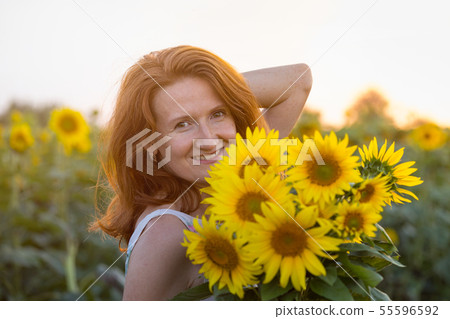Girl and sunflowers Girl and sunflowers 55596592