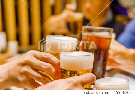Toasting scene at a drinking party 55596705