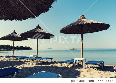 Rock in the sea close to beautiful beach  55597358