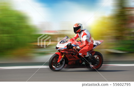 Racing bike rider racing at high speed on a Racing bike rider racing at high speed on a 55602795