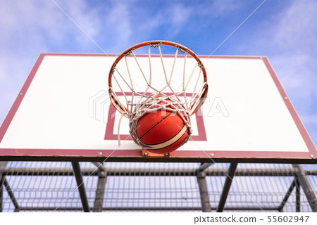 basketball board with basket hoop against blue sky basketball board with basket hoop against blue sky 55602947