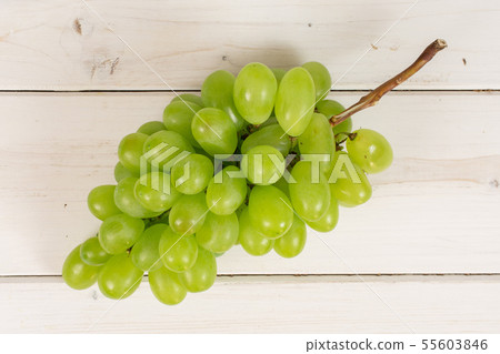 Fresh green grape on grey wood Fresh green grape on grey wood 55603846