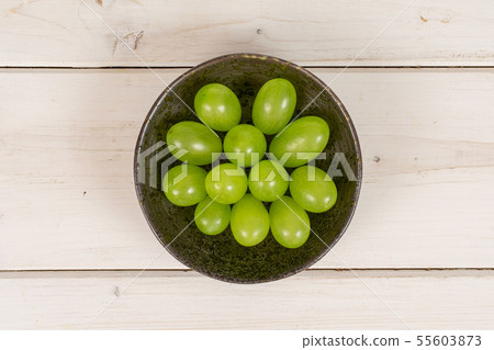 Fresh green grape on grey wood 55603873