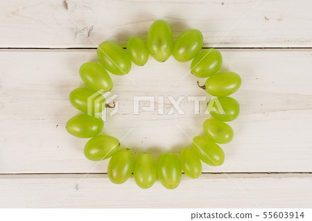 Fresh green grape on grey wood Fresh green grape on grey wood 55603914
