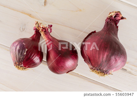 Stale red onion on grey wood Stale red onion on grey wood 55603947