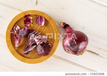 Stale red onion on grey wood Stale red onion on grey wood 55603996