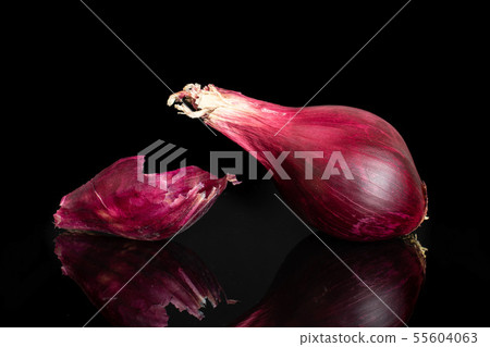 Stale red onion isolated on black glass Stale red onion isolated on black glass 55604063