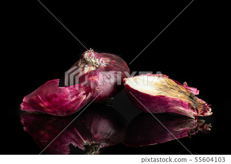 Stale red onion isolated on black glass Stale red onion isolated on black glass 55604103