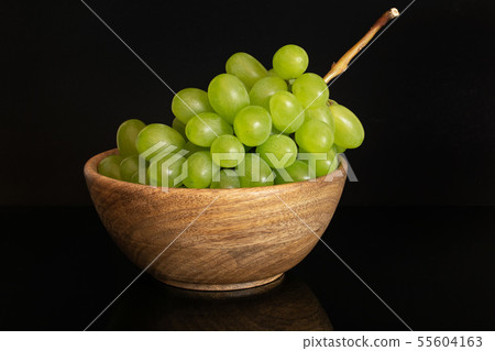 Fresh green grape isolated on black glass Fresh green grape isolated on black glass 55604163