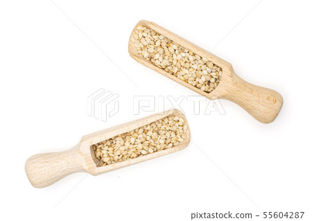 Unpeeled sesame seeds isolated on white Unpeeled sesame seeds isolated on white 55604287