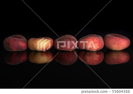Fresh paraguay peach isolated on black glass 55604388