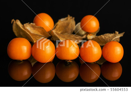 Fresh orange physalis isolated on black glass 55604553