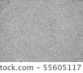 Grey grainy textured asphalt closeup photo 55605117