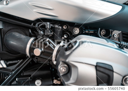Cropped image of new motorcycle in shop. Cropped image of new motorcycle in shop. 55605740