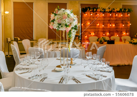 Beautiful table setting with crockery and white Beautiful table setting with crockery and white 55606078