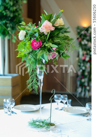 Beautiful table setting with crockery and flower 55606250