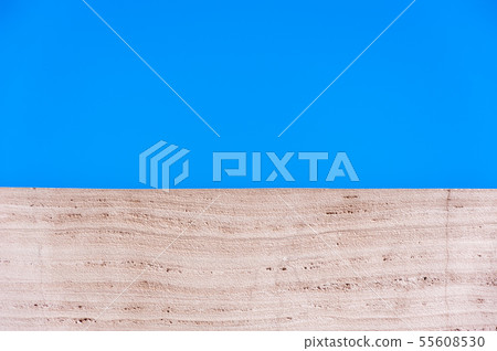 Close-up of brown material against blue sky. 55608530