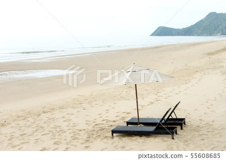 Sunbed with white umbrellas 55608685
