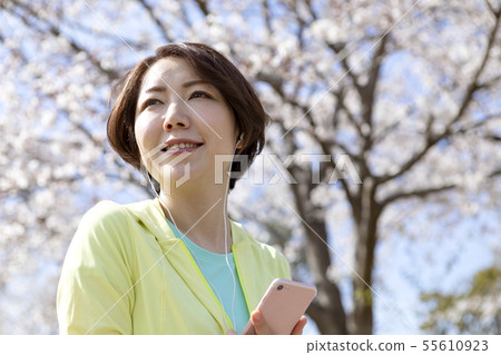 A woman listening to music A woman listening to music 55610923