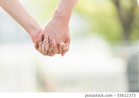 Hand holding body parts 55612373