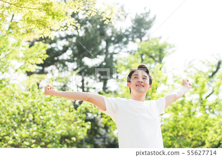 Men in white T-shirt outdoors 55627714