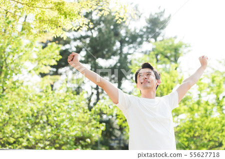 Men in white T-shirt outdoors 55627718