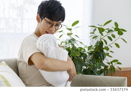 Young dad and baby 55637374