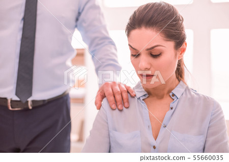 Man putting his hand on the woman shoulder Man putting his hand on the woman shoulder 55660035