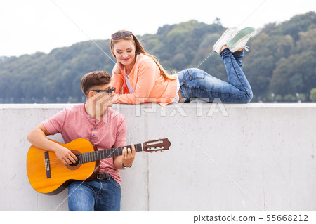 Guitarist and his muse. Guitarist and his muse. 55668212