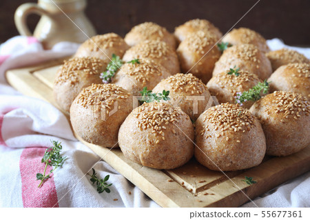 Crown sourdough bread buns with sesame garnish Crown sourdough bread buns with sesame garnish 55677361