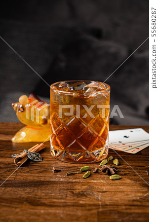 cocktail with cinnamon and cardamom cocktail with cinnamon and cardamom 55680287