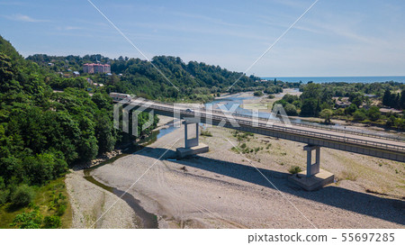 Aerial view of traffic on bridge, 2 lane road with cars Aerial view of traffic on bridge, 2 lane road with cars 55697285